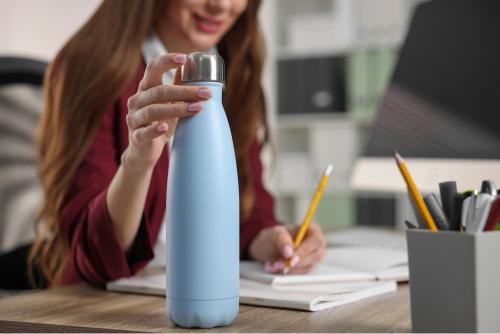 Girl using a reusable water bottle