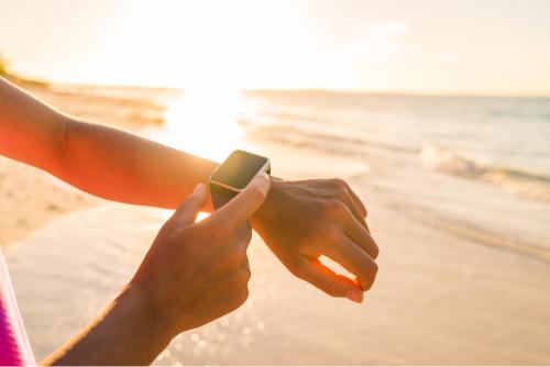 Person using activity tracker outside 