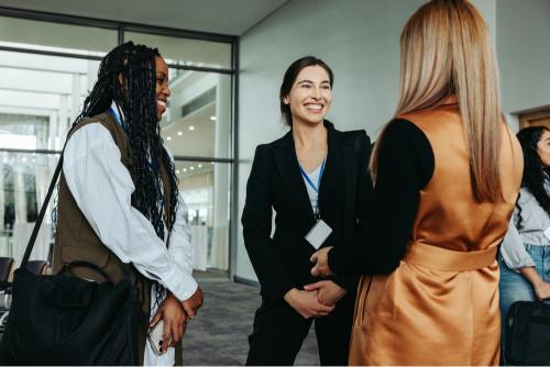 A person networking with two people