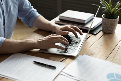 Person using a laptop to write