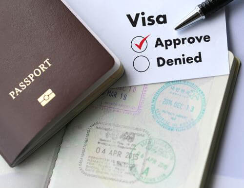 Image that reads visa approved and denied