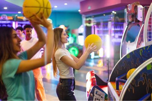 girl playing arcade games